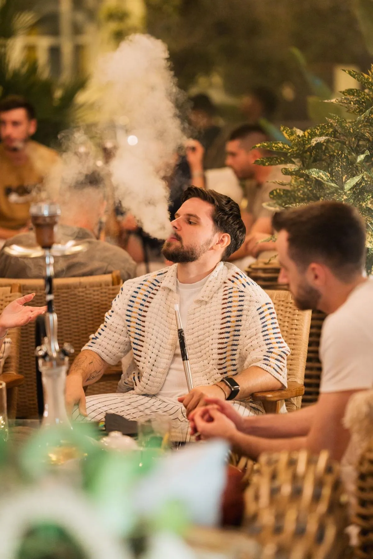 Guest relaxing with shisha in the Komodo Lounge
