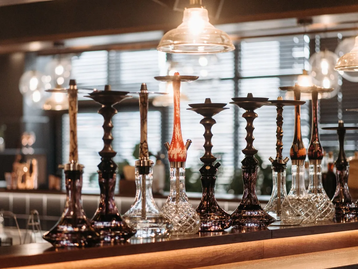 A row of shisha bases on a bar counter